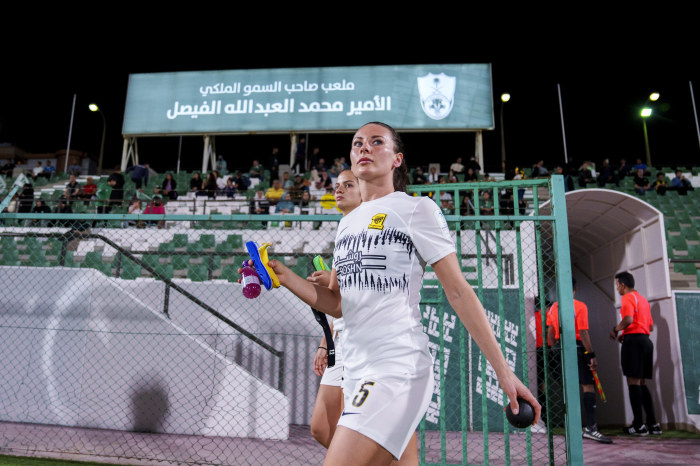 Al Ittihad's Leighanne Robe walks onto the pitch in Saudi Arabia.